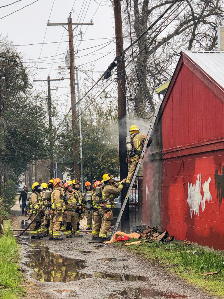 austin firefighters controlling a residential fire