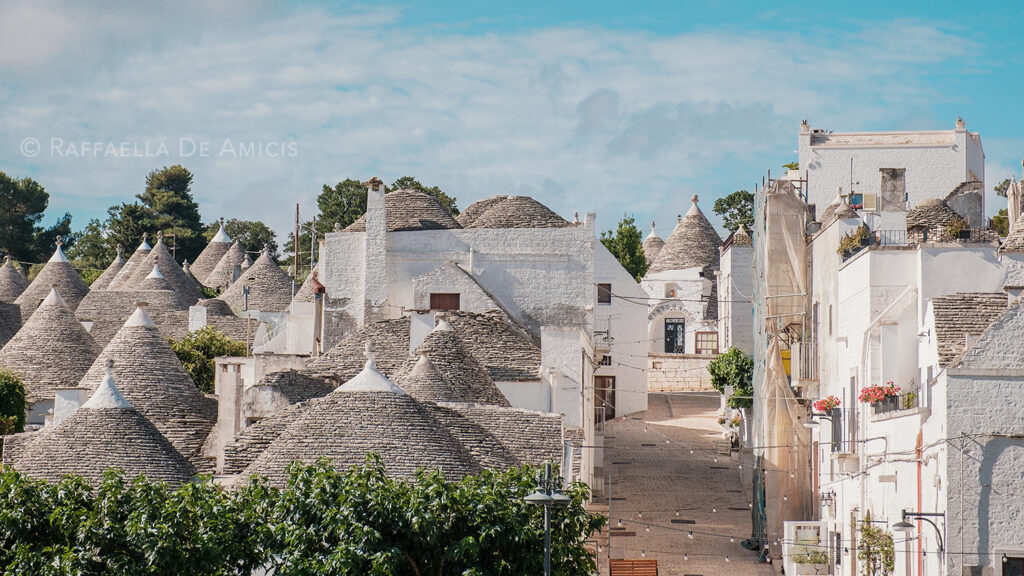 Whitewashed trulli and their conical roofs in Puglia, Italy. A must for any Puglia Itinerary.