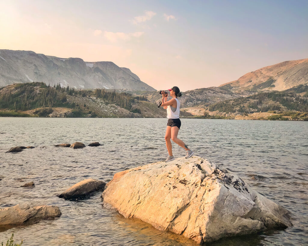 wanderstruck ella travel photographer on a mountain lake in Wyoming