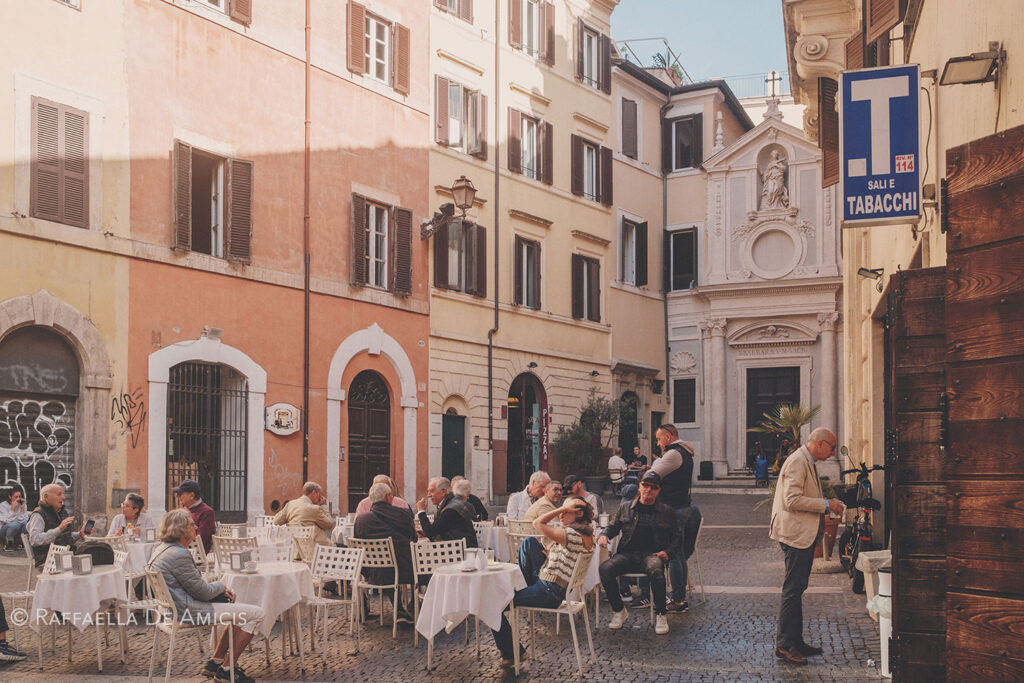 historic center of rome, people at a cafe outside, photographed using a 23mm fujinon lens