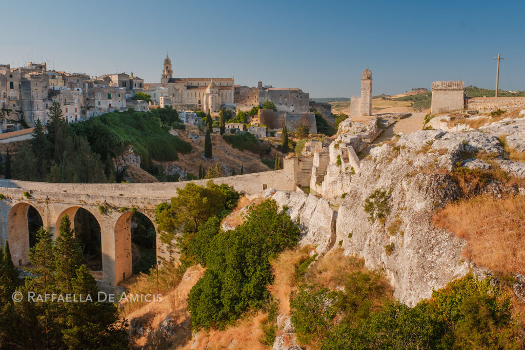 ancient aqueduct connects ancient ruins with the rustic village Gravina in Puglia