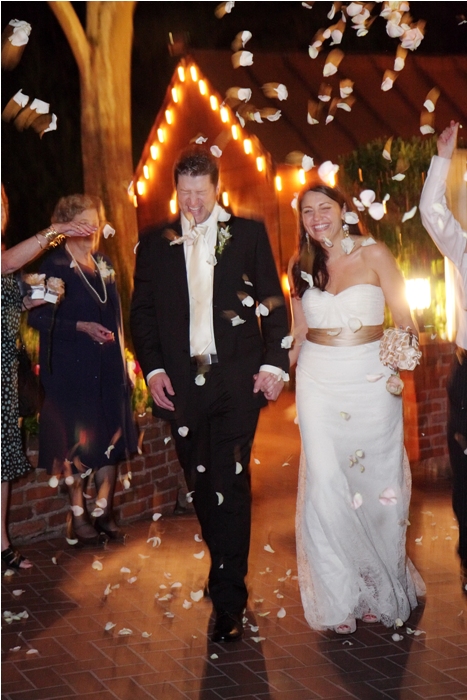 example of slow-sync flash used to capture a couple leaving their wedding reception
